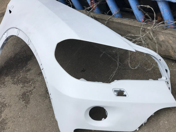 Bmw X5 E70 2013 driver side wing has fog light holes has been primed. Ready for spray